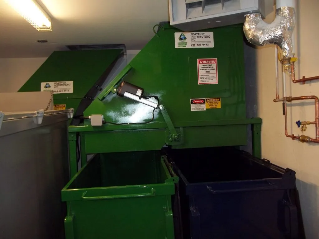 Trisorter recycling diversion system installed at the base of a garbage chute